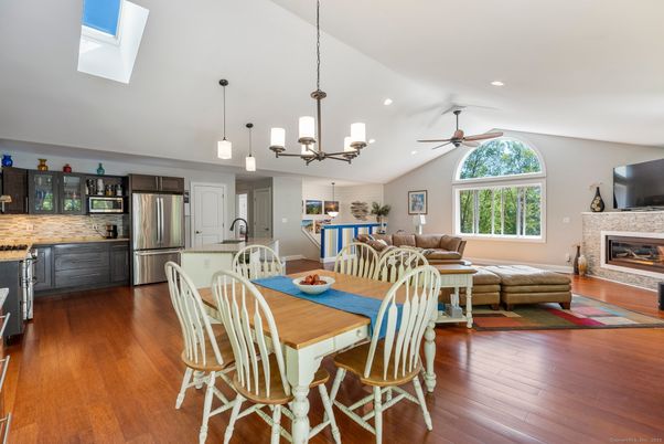 Dining room, Fireplace, Interior, Kitchen, Living room, Pendant Lights, Recessed Lighting, Stainless Steel Appliances, Wood Texture Flooring