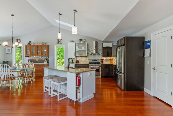 Dining room, Interior, Kitchen, Pendant Lights, Stainless Steel Appliances, Wood Texture Flooring