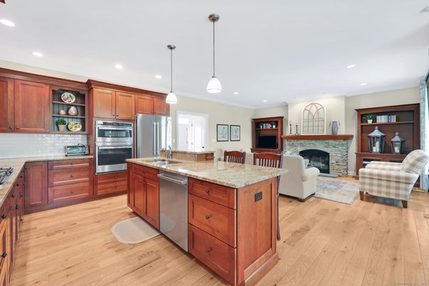 Fireplace, Interior, Kitchen, Living room, Pendant Lights, Recessed Lighting, Stainless Steel Appliances, Wood Texture Flooring