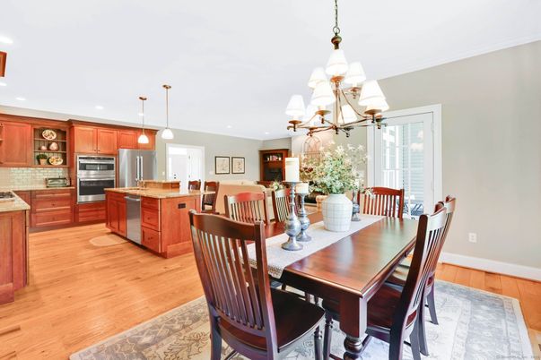 Chandelier, Dining room, Interior, Kitchen, Pendant Lights, Recessed Lighting, Stainless Steel Appliances, Wood Texture Flooring