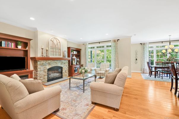 Chandelier, Dining room, Fireplace, Interior, Living room, Recessed Lighting, Wood Texture Flooring