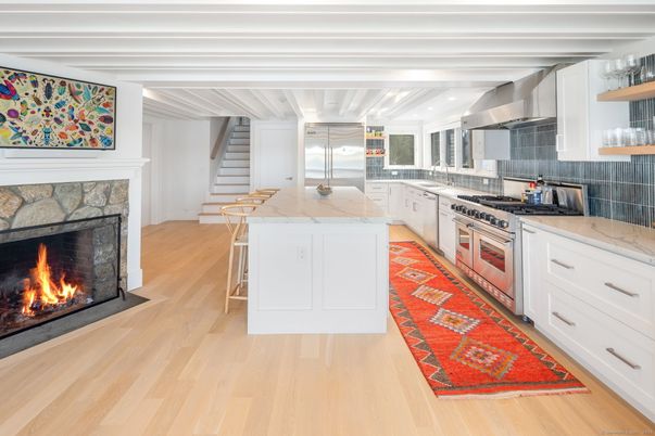 Fireplace, Interior, Kitchen, Recessed Lighting, Stainless Steel Appliances, Wood Texture Flooring