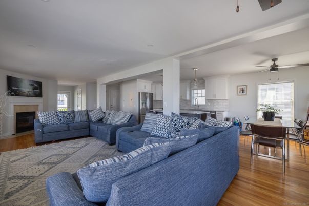Dining room, Fireplace, Interior, Kitchen, Living room, Pendant Lights, Stainless Steel Appliances, Wood Texture Flooring