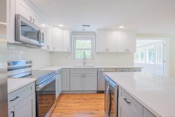 Interior, Kitchen, Recessed Lighting, Stainless Steel Appliances, Wood Texture Flooring