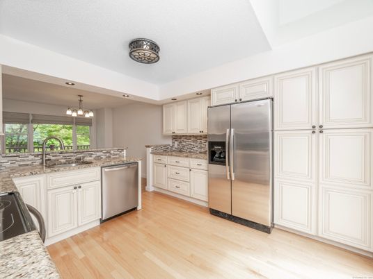 Chandelier, Interior, Kitchen, Pendant Lights, Recessed Lighting, Stainless Steel Appliances, Wood Texture Flooring