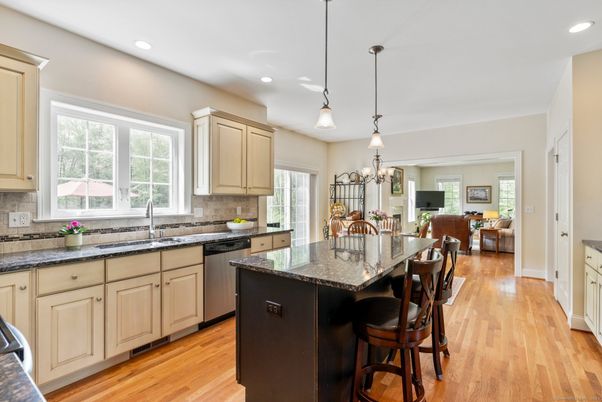 Chandelier, Interior, Kitchen, Living room, Pendant Lights, Recessed Lighting, Stainless Steel Appliances, Wood Texture Flooring