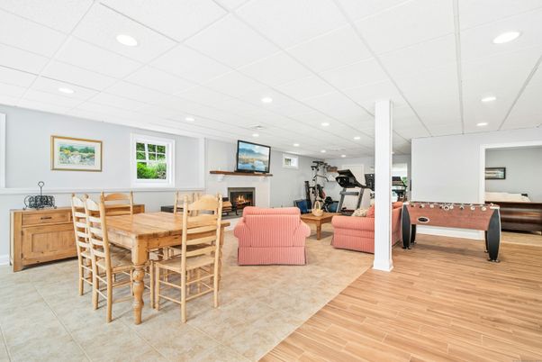 Dining room, Fireplace, Fitness Equipment, Interior, Living room, Recessed Lighting, Wood Texture Flooring
