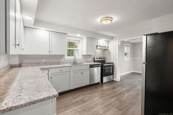 Interior, Kitchen, Recessed Lighting, Stainless Steel Appliances, Wood Texture Flooring