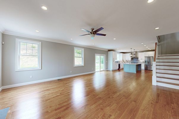 Empty room, Interior, Kitchen, Recessed Lighting, Stainless Steel Appliances, Wood Texture Flooring