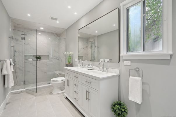 Bathroom, Dual Sink Vanities, Glass Shower, Interior, Marble Walls, Recessed Lighting