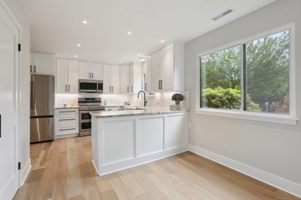 Interior, Kitchen, Recessed Lighting, Stainless Steel Appliances, Wood Texture Flooring