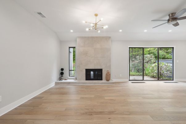 Empty room, Fireplace, Interior, Pendant Lights, Recessed Lighting, Wood Texture Flooring