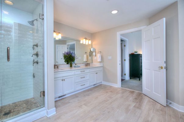Bathroom, Dual Sink Vanities, Glass Shower, Interior, Recessed Lighting, Wood Texture Flooring