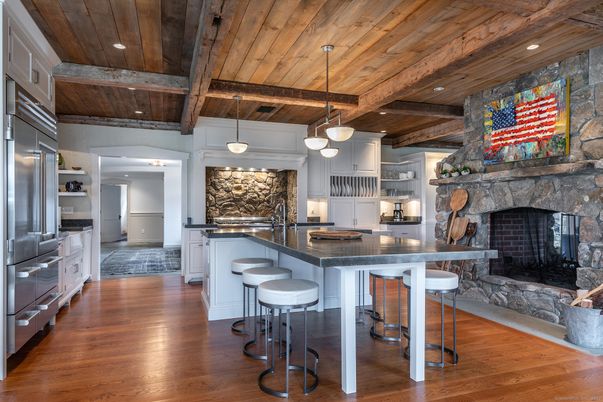 Fireplace, Interior, Kitchen, Pendant Lights, Recessed Lighting, Stainless Steel Appliances, Stone Walls, Wooden Beams, Wooden Ceilings, Wood Texture Flooring