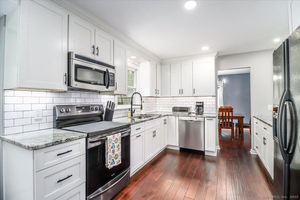 Dining room, Interior, Kitchen, Recessed Lighting, Stainless Steel Appliances, Wood Texture Flooring