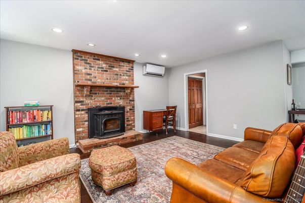 Fireplace, Interior, Living room, Recessed Lighting, Stone Walls, Wood Texture Flooring