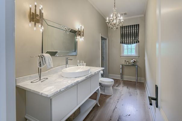 Bathroom, Chandelier, Dual Sink Vanities, Interior, Wood Texture Flooring