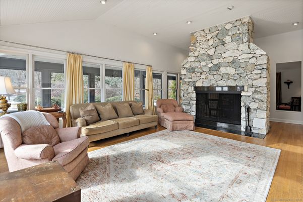 Fireplace, Interior, Living room, Recessed Lighting, Stone Walls, Wood Texture Flooring