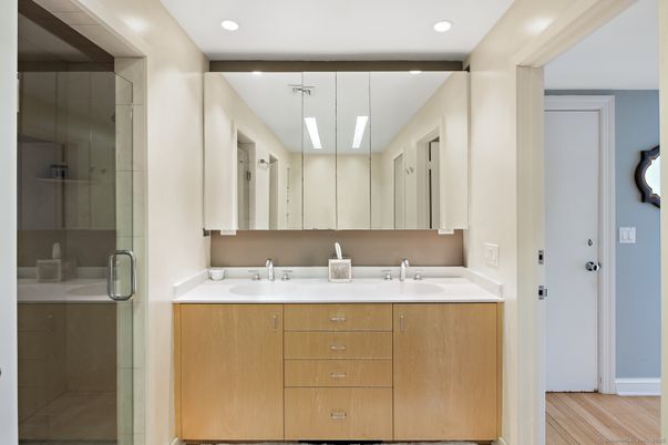 Bathroom, Dual Sink Vanities, Glass Shower, Interior, Recessed Lighting, Wood Texture Flooring