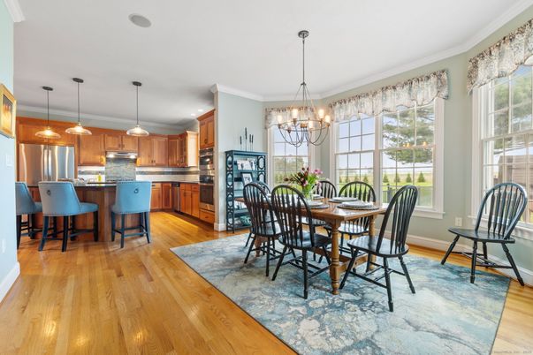 Chandelier, Dining room, Interior, Kitchen, Pendant Lights, Recessed Lighting, Stainless Steel Appliances, Wood Texture Flooring
