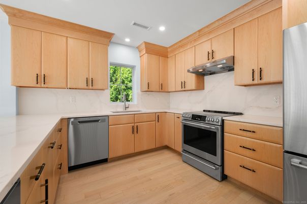 Interior, Kitchen, Marble Walls, Recessed Lighting, Stainless Steel Appliances, Wood Texture Flooring