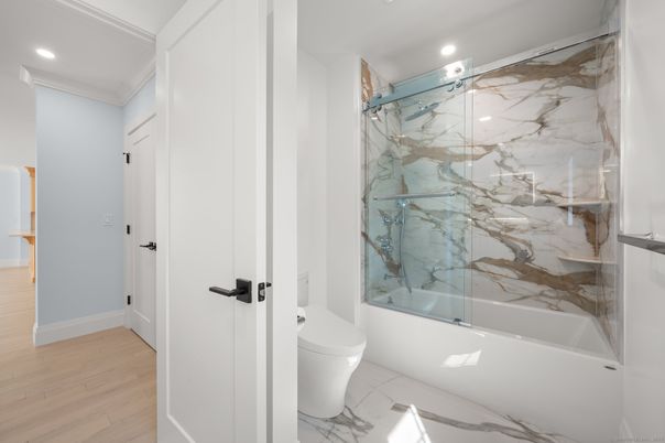 Bathroom, Glass Shower, Interior, Marble, Marble Walls, Recessed Lighting, Wood Texture Flooring