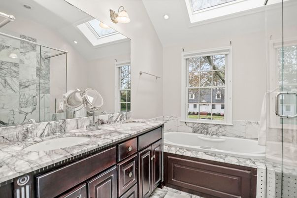 Bathroom, Dual Sink Vanities, Glass Shower, Interior, Marble Walls, Recessed Lighting