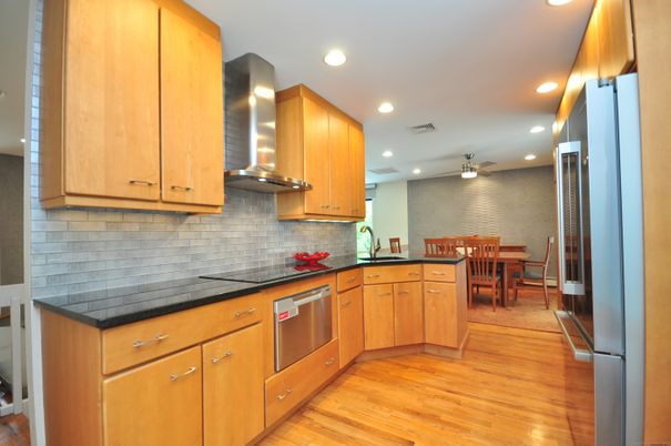 Dining room, Interior, Kitchen, Recessed Lighting, Stainless Steel Appliances, Stone Walls, Wood Texture Flooring