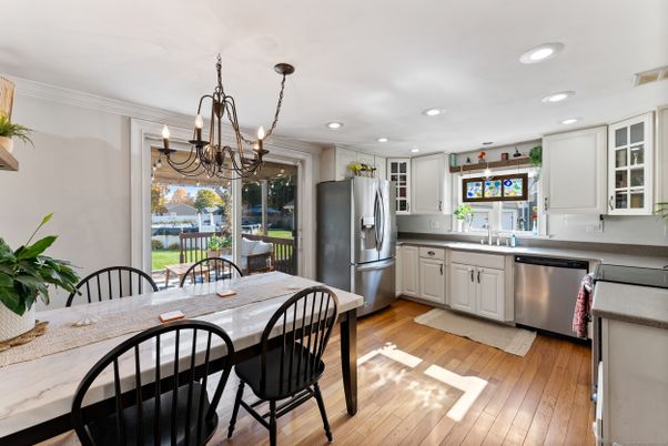 Chandelier, Dining room, Interior, Kitchen, Recessed Lighting, Stainless Steel Appliances, Wood Texture Flooring