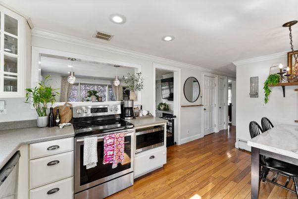 Dining room, Interior, Kitchen, Pendant Lights, Recessed Lighting, Stainless Steel Appliances, Wood Texture Flooring