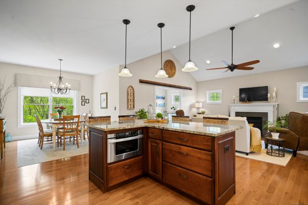 Chandelier, Dining room, Fireplace, Interior, Kitchen, Living room, Pendant Lights, Recessed Lighting, Wood Texture Flooring