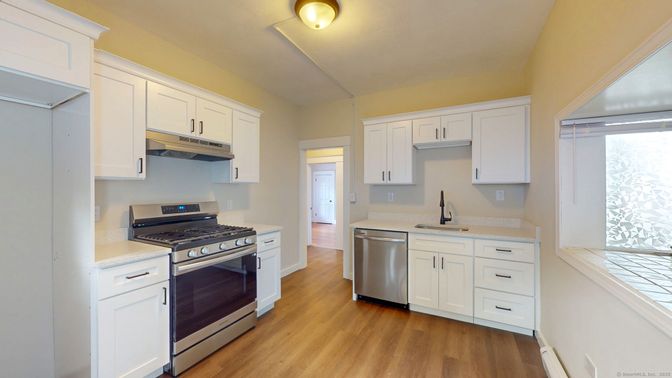 Interior, Kitchen, Stainless Steel Appliances, Tile Countertops, Wood Texture Flooring