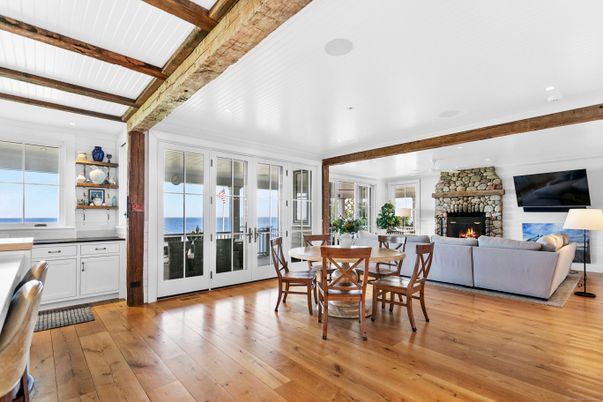 Dining room, Fireplace, Interior, Living room, Recessed Lighting, Water, Wooden Beams, Wood Texture Flooring