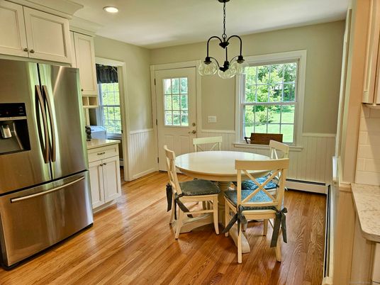 Dining room, Interior, Kitchen, Pendant Lights, Recessed Lighting, Stainless Steel Appliances, Wood Texture Flooring