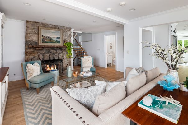 Fireplace, Interior, Living room, Recessed Lighting, Stone Walls, Wood Texture Flooring