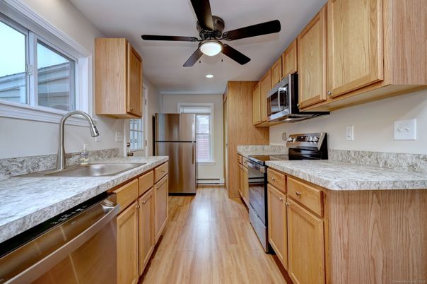 Interior, Kitchen, Recessed Lighting, Tile Countertops, Wood Texture Flooring