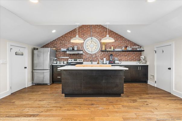 Interior, Kitchen, Pendant Lights, Recessed Lighting, Stainless Steel Appliances, Stone Walls, Wood Texture Flooring