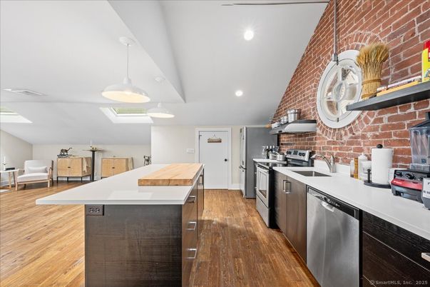 Interior, Kitchen, Pendant Lights, Recessed Lighting, Stainless Steel Appliances, Stone Walls, Wood Texture Flooring