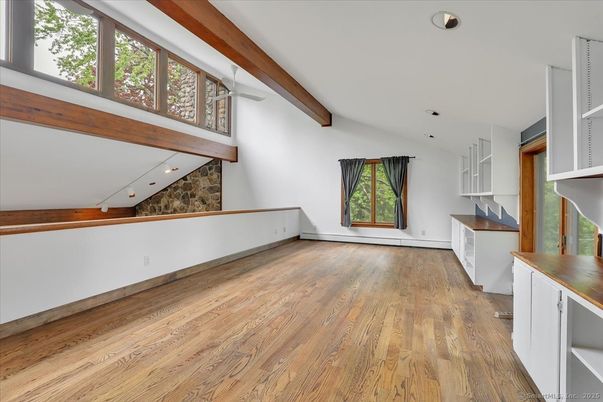 Empty room, Fireplace, Interior, Recessed Lighting, Stone Walls, Wooden Beams, Wood Texture Flooring
