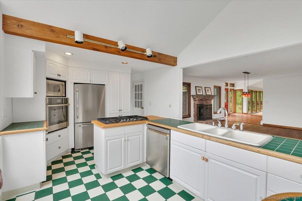 Fireplace, Interior, Kitchen, Recessed Lighting, Stainless Steel Appliances, Wooden Beams