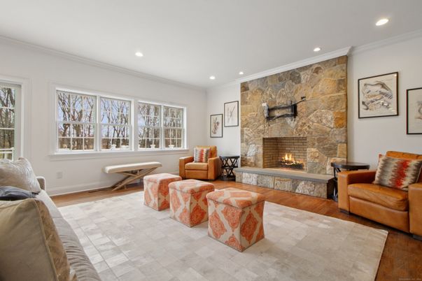 Fireplace, Interior, Living room, Recessed Lighting, Stone Walls, Wood Texture Flooring