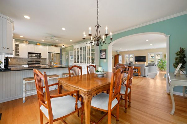 Chandelier, Dining room, Interior, Kitchen, Living room, Recessed Lighting, Stainless Steel Appliances, Wood Texture Flooring