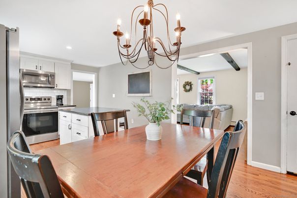 Chandelier, Dining room, Interior, Kitchen, Recessed Lighting, Stainless Steel Appliances, Wood Texture Flooring