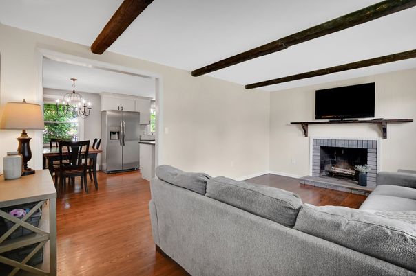 Chandelier, Dining room, Fireplace, Interior, Living room, Stainless Steel Appliances, Wooden Beams, Wood Texture Flooring