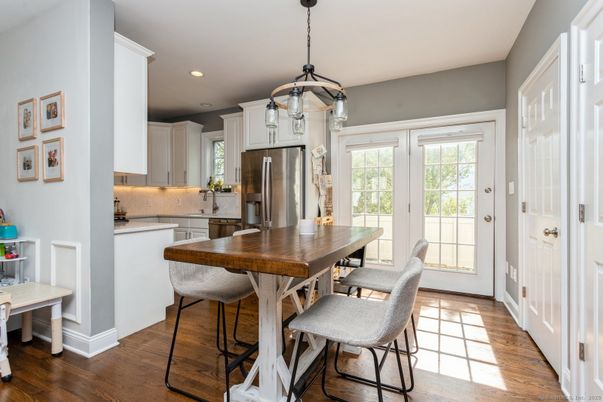 Dining room, Interior, Kitchen, Pendant Lights, Recessed Lighting, Stainless Steel Appliances, Wood Texture Flooring