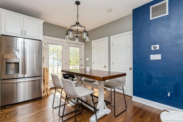 Dining room, Interior, Kitchen, Pendant Lights, Stainless Steel Appliances, Wood Texture Flooring