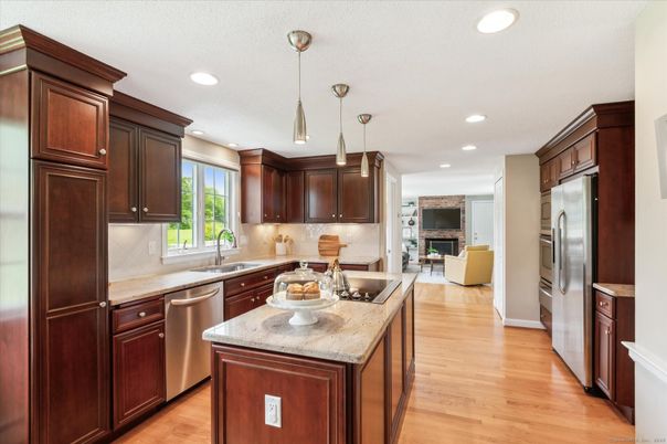 Fireplace, Interior, Kitchen, Pendant Lights, Recessed Lighting, Stainless Steel Appliances, Wood Texture Flooring