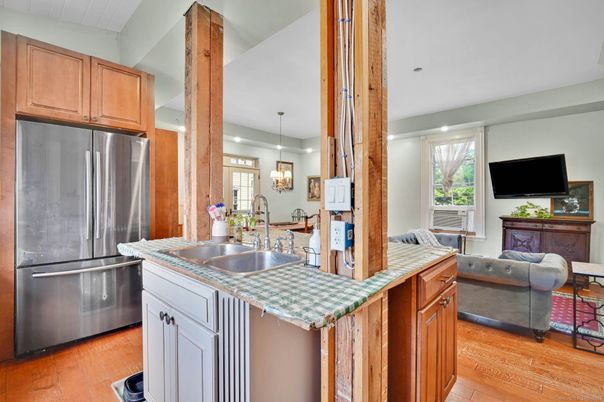 Interior, Kitchen, Pendant Lights, Recessed Lighting, Stainless Steel Appliances, Tile Countertops, Wood Texture Flooring