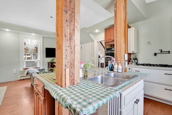 Interior, Kitchen, Recessed Lighting, Tile Countertops, Wood Texture Flooring