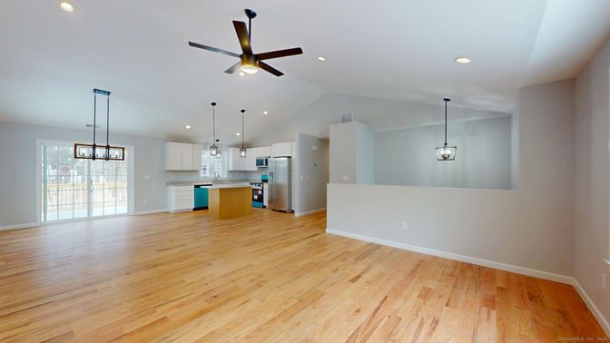 Empty room, Interior, Kitchen, Pendant Lights, Recessed Lighting, Stainless Steel Appliances, Wood Texture Flooring